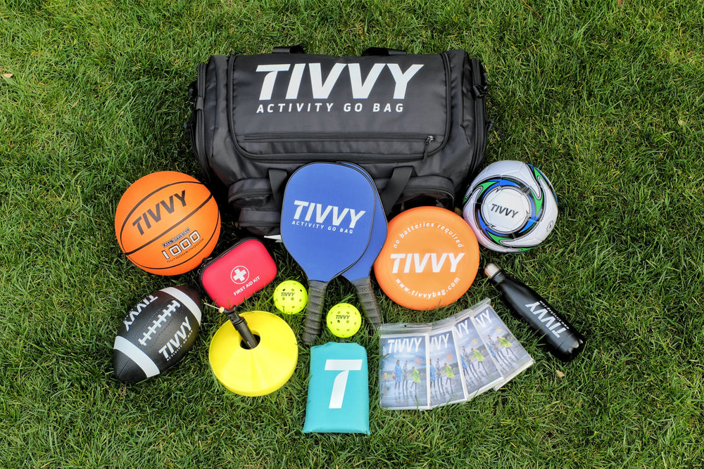 Pre-packed kids sports bag with basketball soccer ball football and outdoor gear