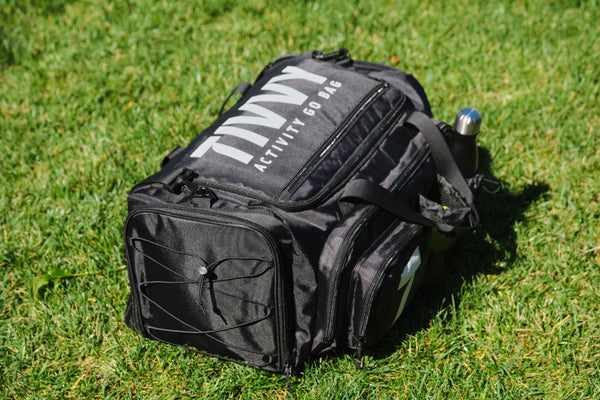 Pre-packed kids sports bag with basketball soccer ball football and outdoor gear