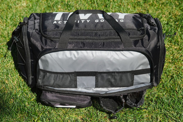 Pre-packed kids sports bag with basketball soccer ball football and outdoor gear