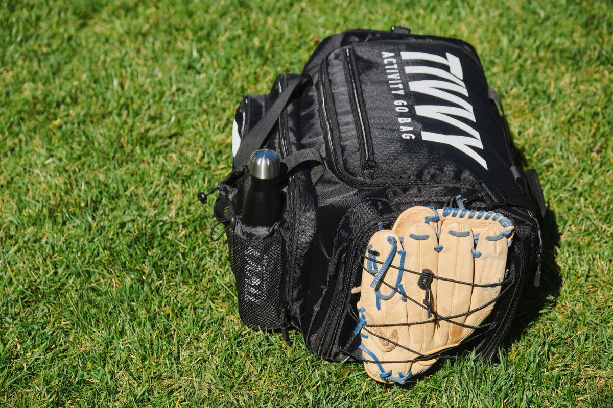 TIVVY  bag with a baseball glove on a grassy field