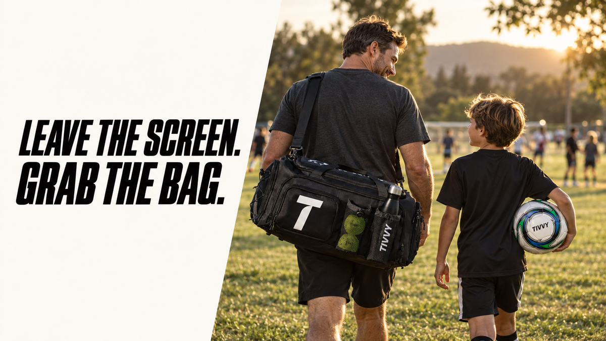 A man and a child walk on a grassy sports field at sunset, with the man carrying a black Tory Burch duffel bag over his shoulder. The left side of the image has a white diagonal panel with the text 'LEAVE THE SCREEN.